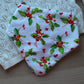 Baby bib with holly berry pattern