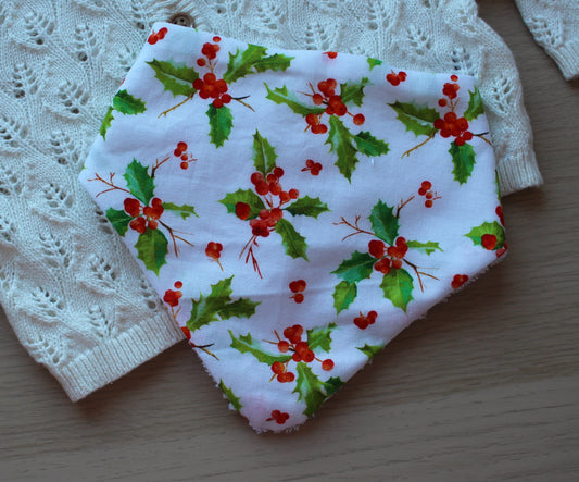 Baby bib with holly berry pattern