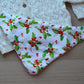 Christmas baby bib with holly berry design