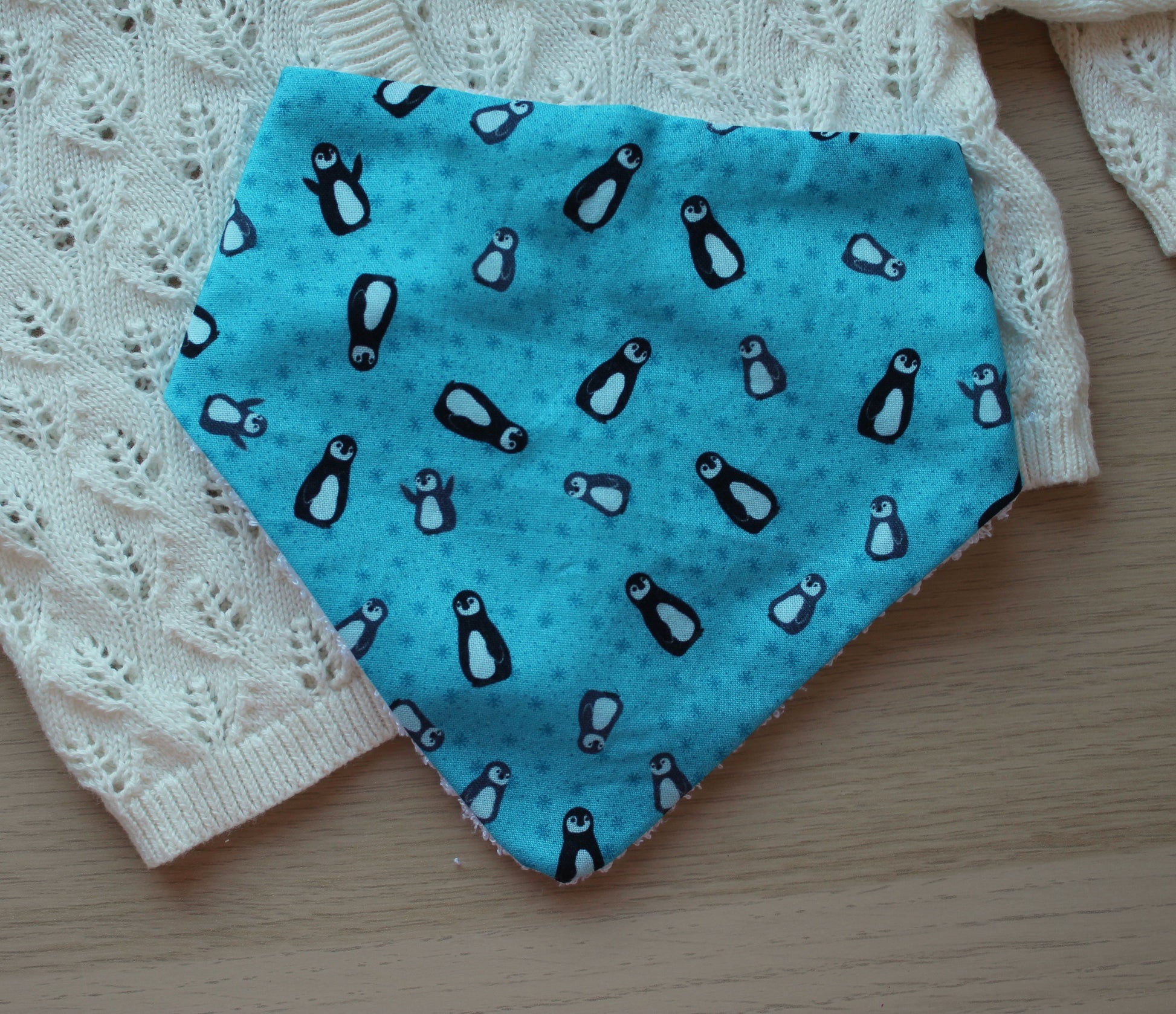 Baby dribble bib in blue with penguins