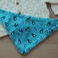 Festive penguin baby bib