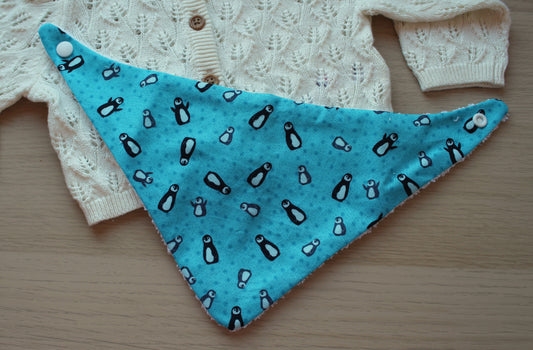 Festive penguin baby bib