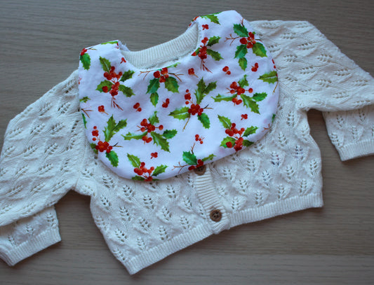 Baby bib with festive holly berry design