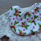 Baby bib with holly and berries