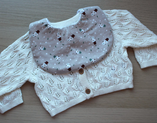 Baby bib with small snowman design