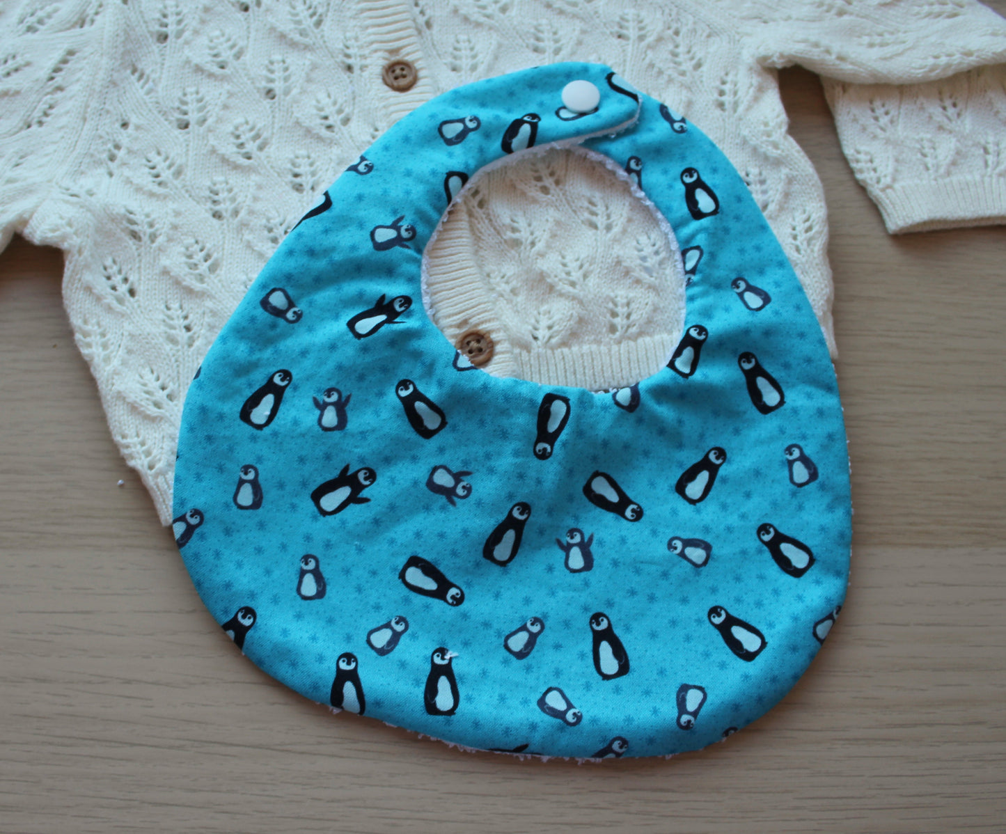 Penguin themed festive baby bib