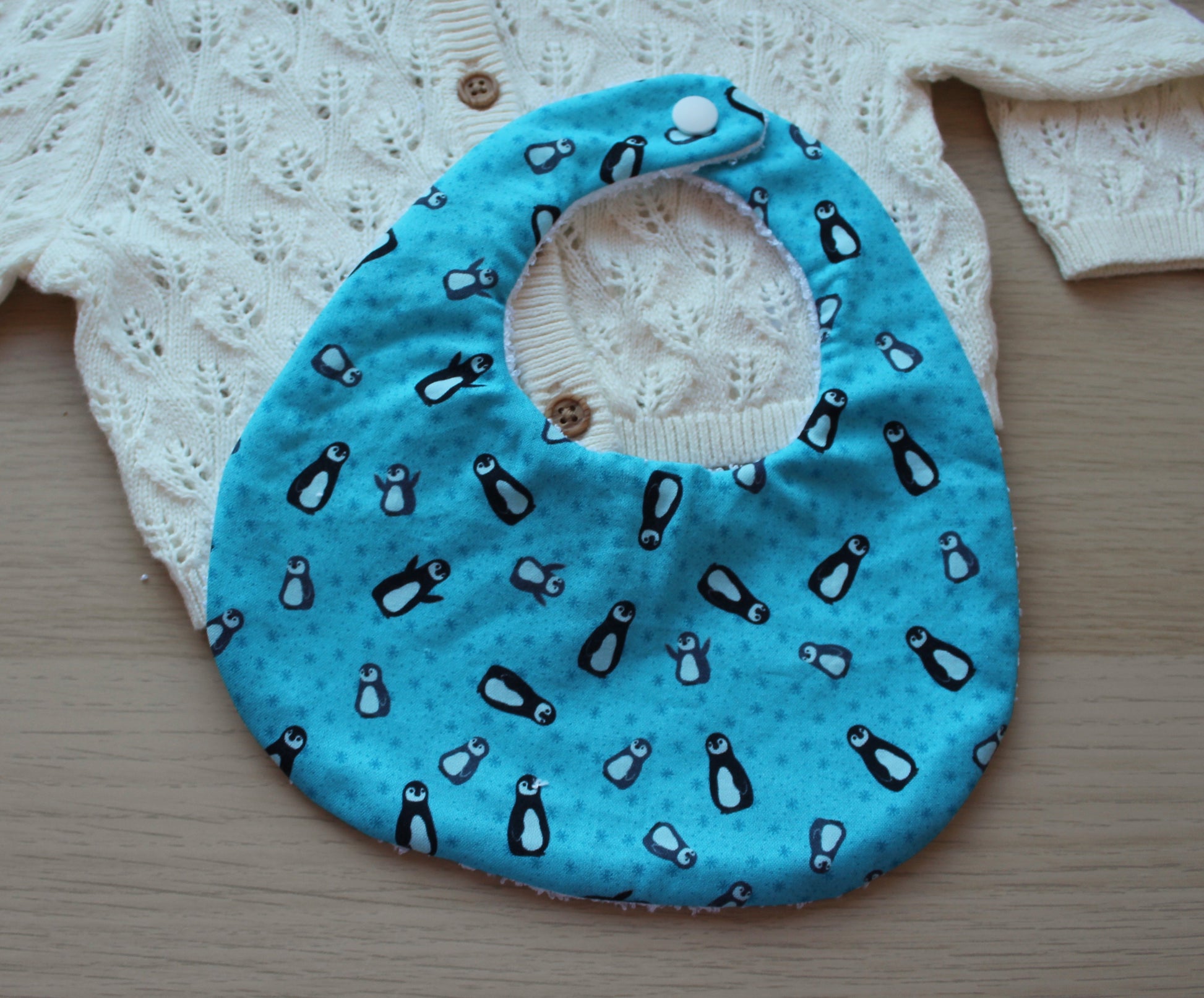 Penguin themed festive baby bib