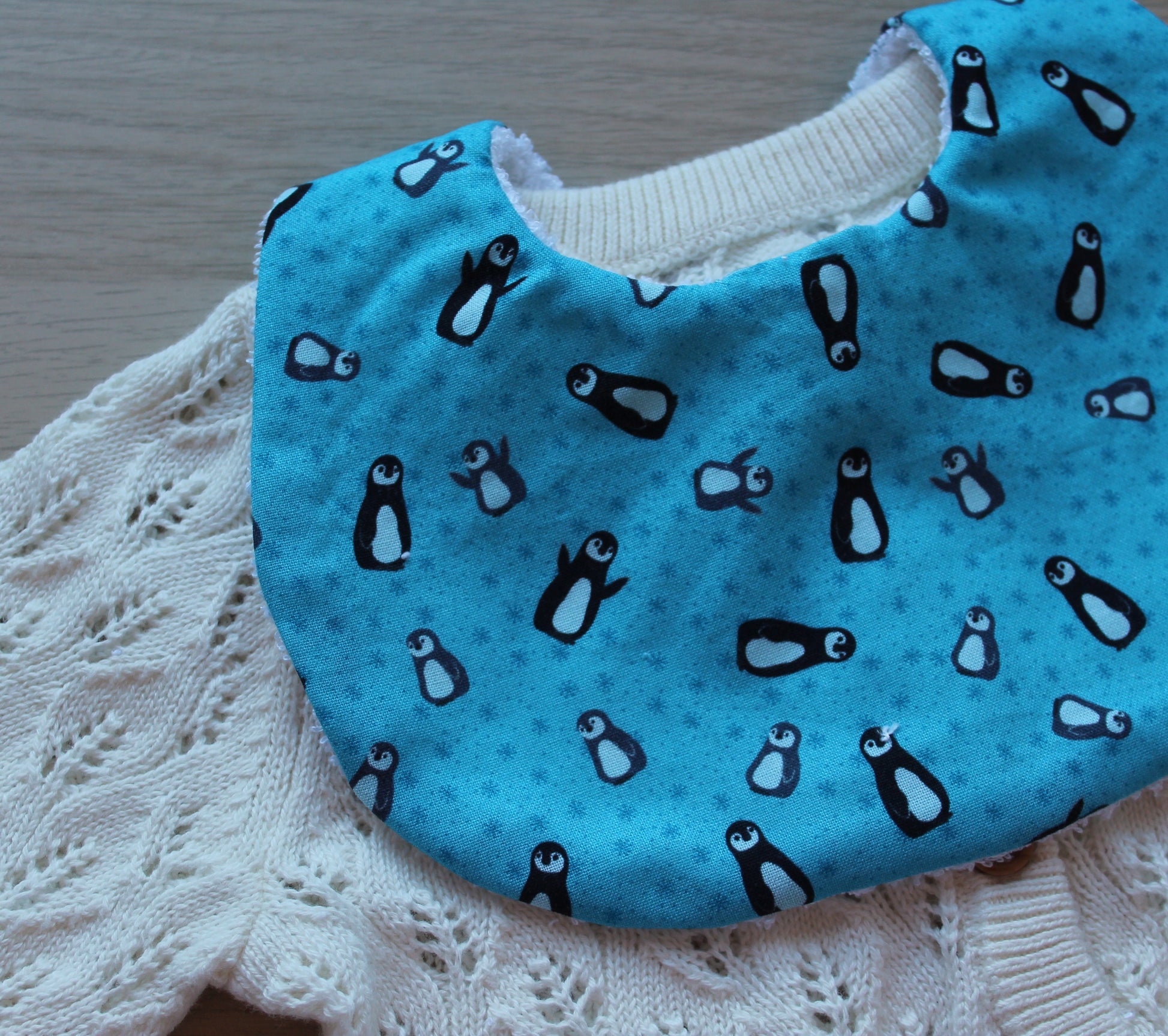 baby bib with penguins