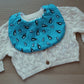 Baby bib in blue with penguins