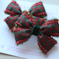 Red and green tartan hair clips with tinsel