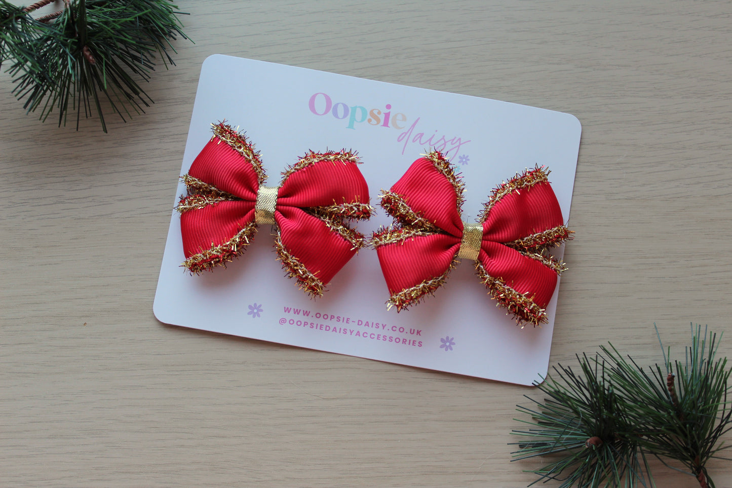 Set of 2 red hair bows with gold tinsel
