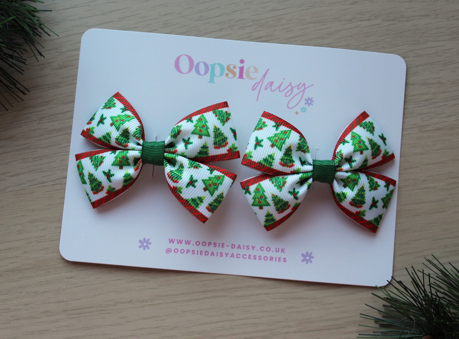 Two Christmas-themed hair bows 