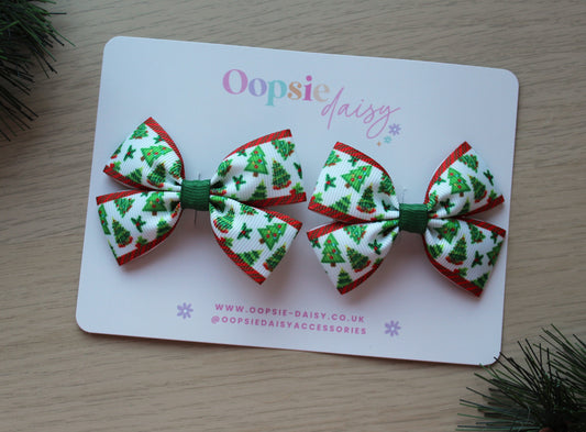 Two Christmas-themed hair bows 
