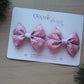 Snowflake hair bows in pink