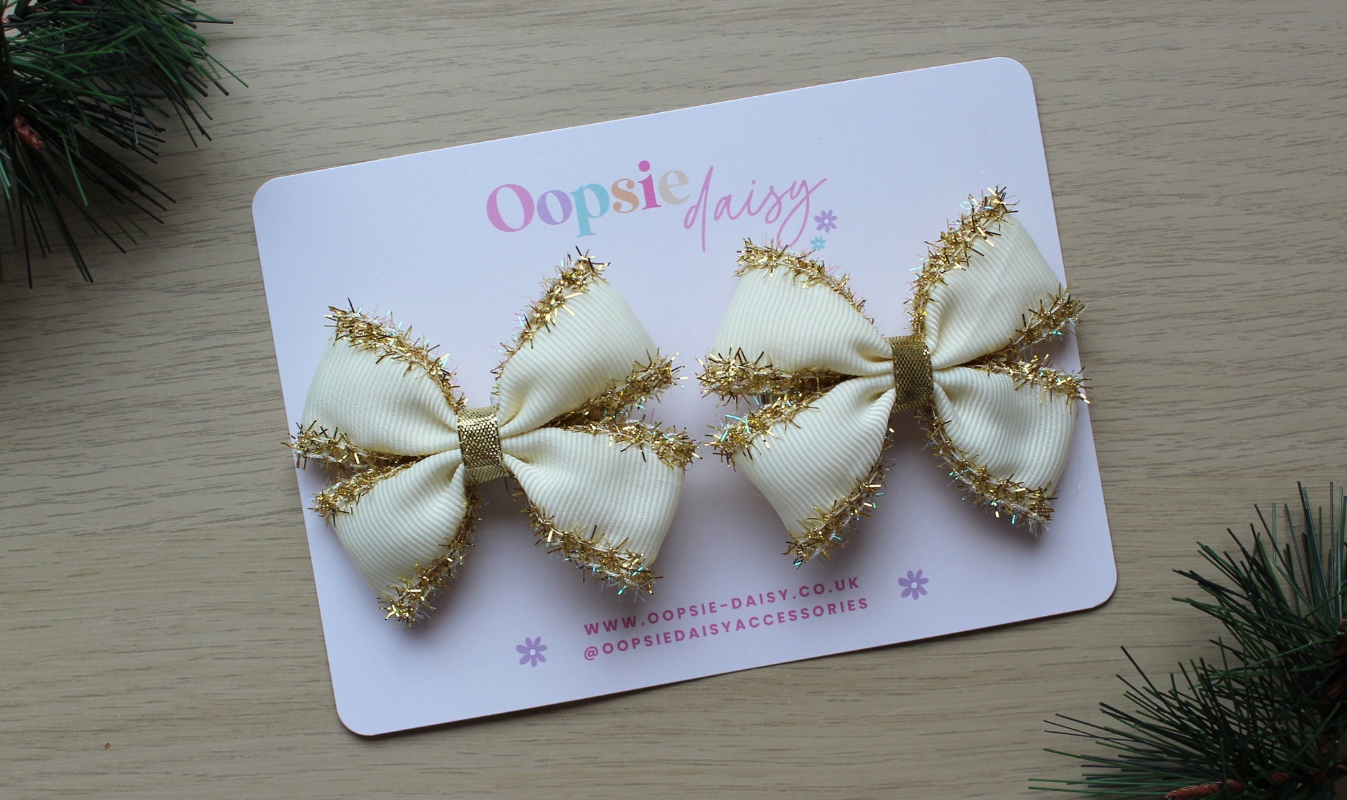 Set of 2 cream hair bows with gold tinsel
