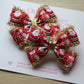 Santa and snowman hair bows with gold tinsel