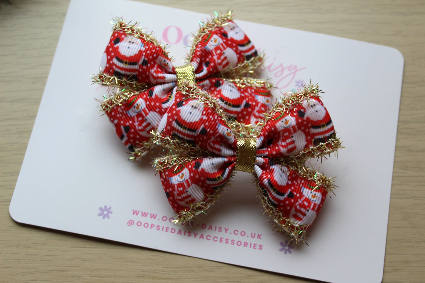Santa and snowman hair bows with gold tinsel