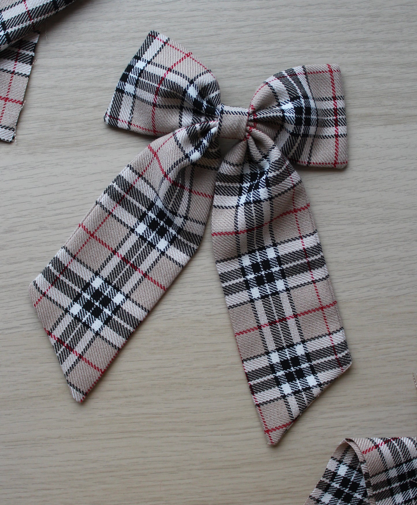 Beige and black plaid tartan hair bow