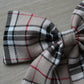 Beige and black plaid tartan hair bow