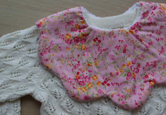 Frill baby bib with pink ditsy flowers