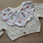 Floral baby bib with goose