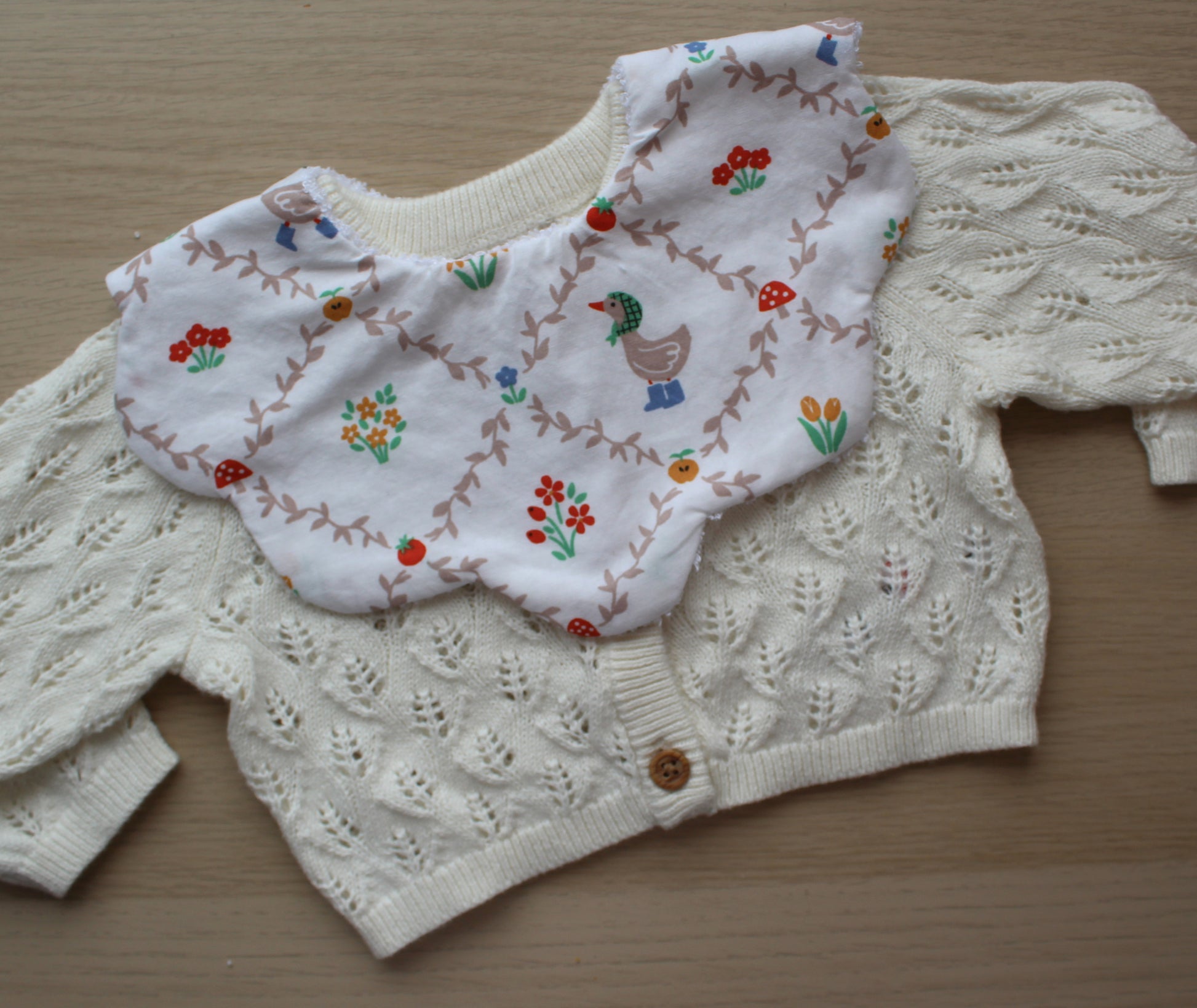 Floral baby bib with goose
