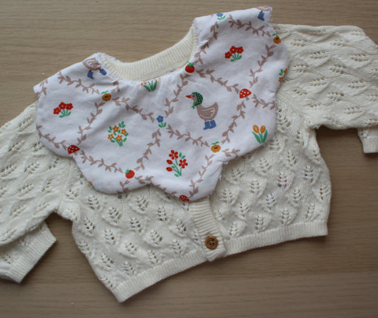 Floral baby bib with goose