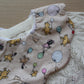 Scallop bib with winnie and piglet pattern