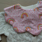 Rainbow polka dot pattern baby bib with scallop edges