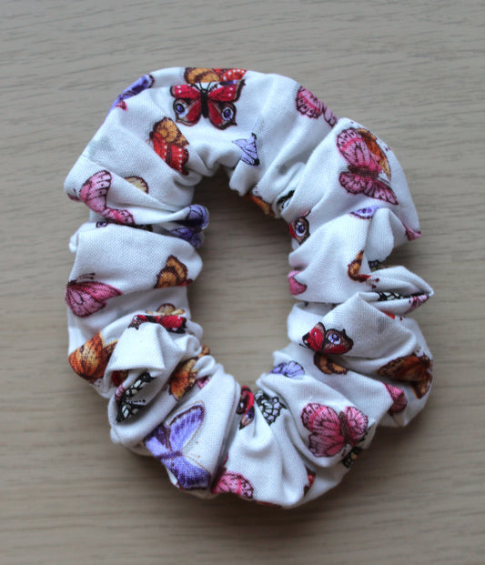 Hair scrunchie with white background and butterflies