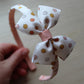 Nude floral bow on a headband