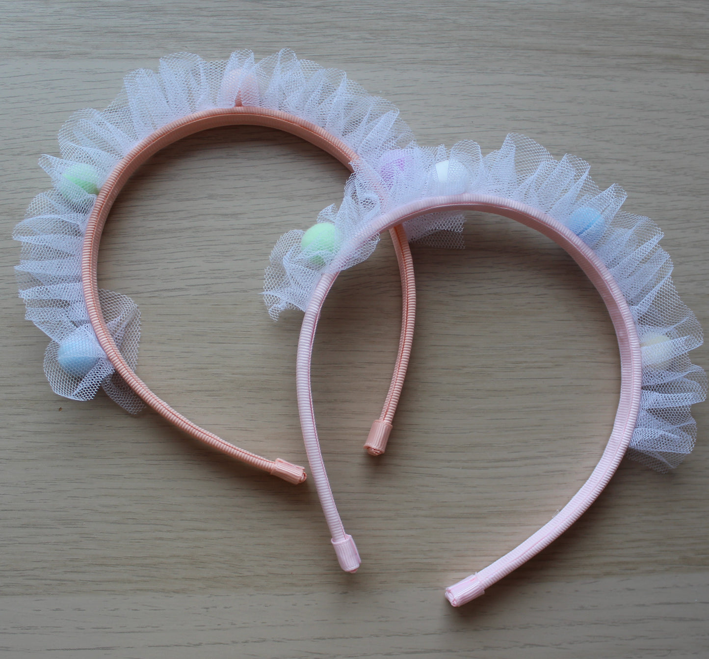 Headbands with tulle frill and pom poms 