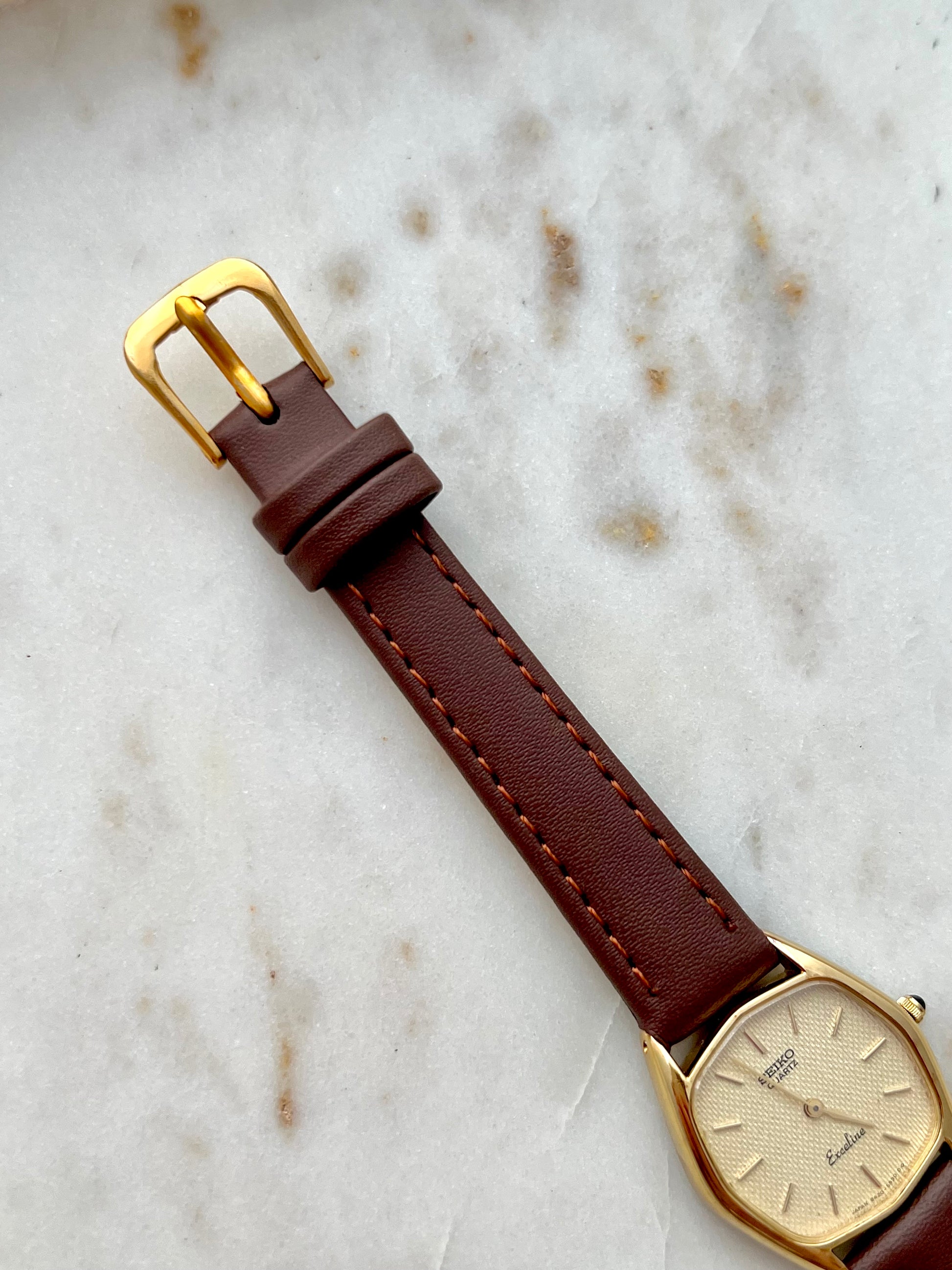 Oversized blue tartan hair scrunchie on wrist