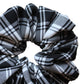 Close up black and white monochrome plaid tartan scrunchie