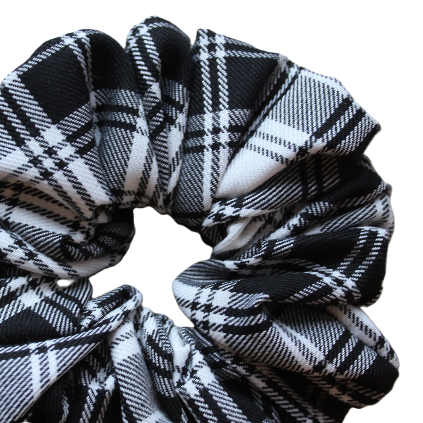 Close up black and white monochrome plaid tartan scrunchie