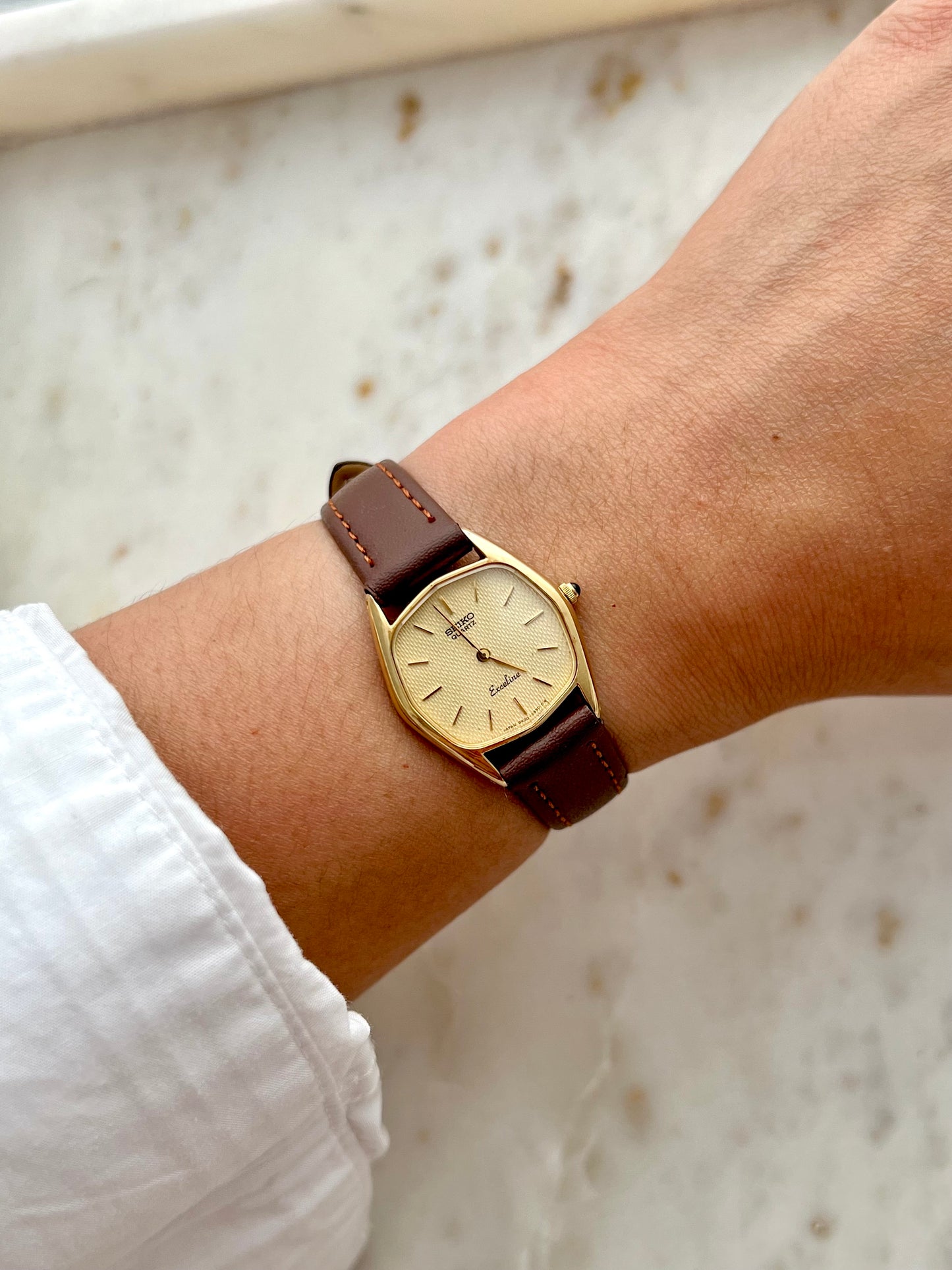 Black and white tartan plaid hair scrunchie on wrist