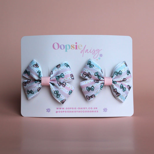 Pink and blue toddler hair clips with bows