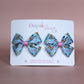 Pair colourful baby animal bow hair clips. 