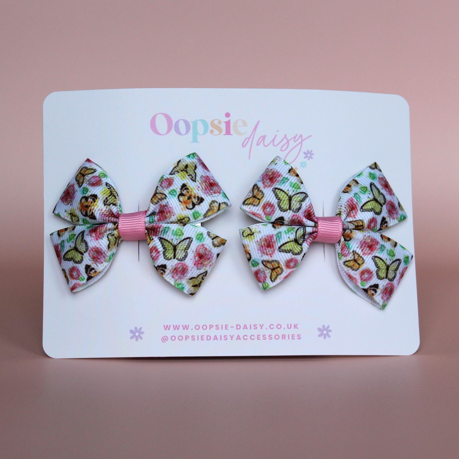 Pair hair bow clips with vintage butterfly design