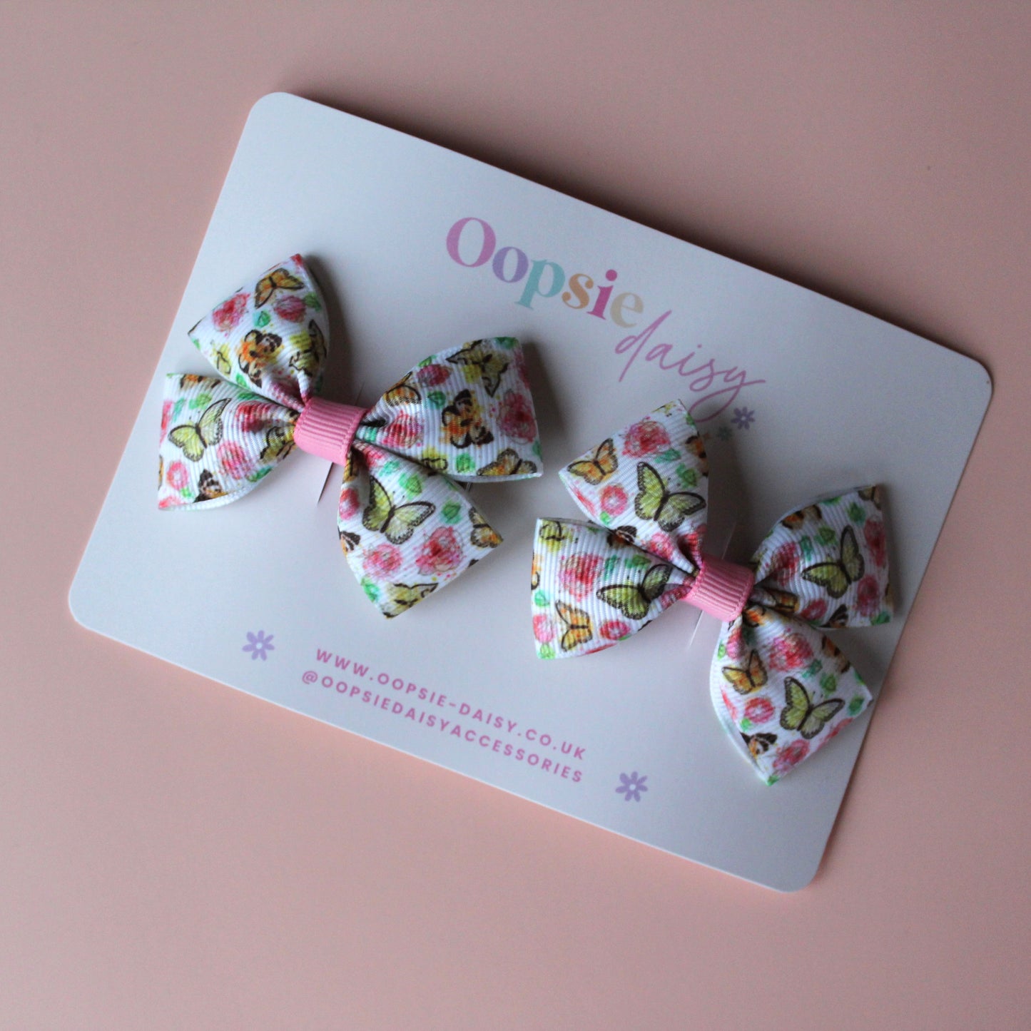 Pair hair bow clips with vintage butterfly design