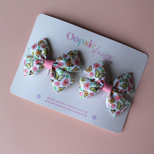 Pair hair bow clips with vintage butterfly design