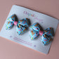 Pair colourful baby animal bow hair clips. 