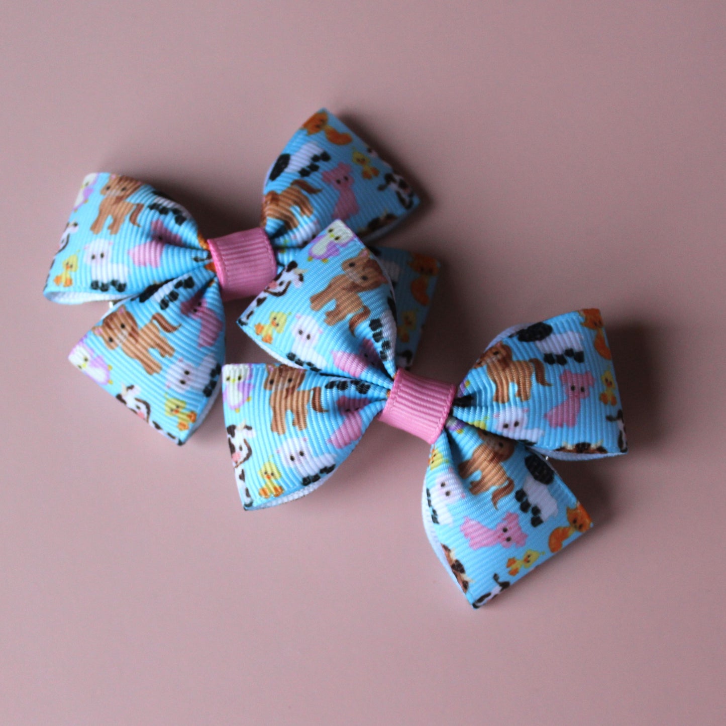 Pair colourful baby animal bow hair clips. 