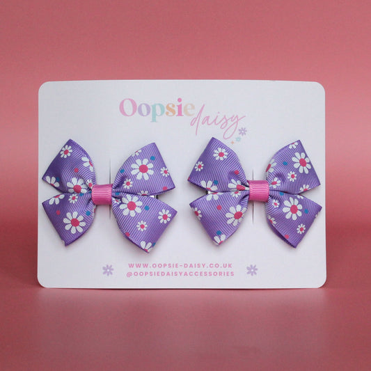 Pink and purple daisy bow hair clips