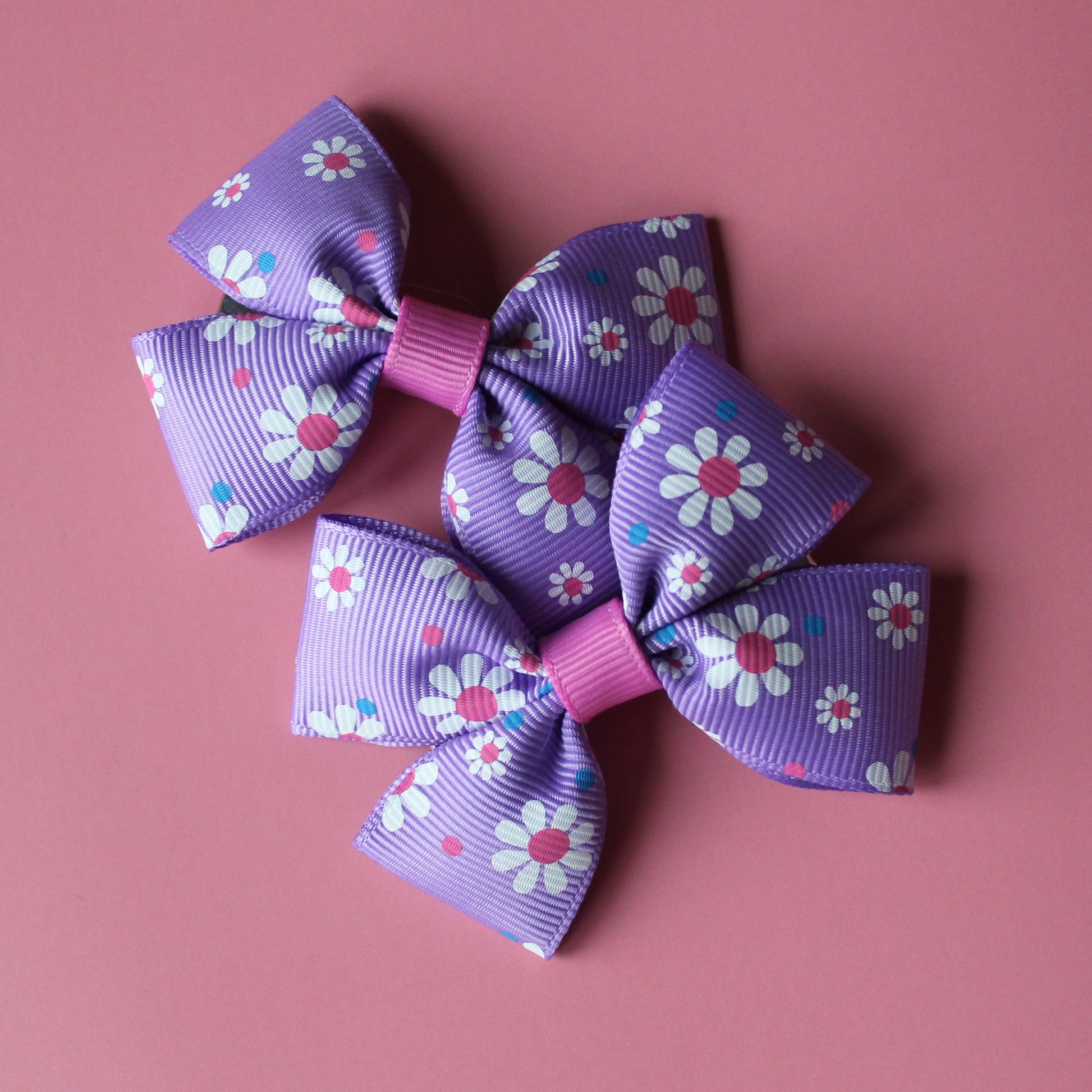 Pink and purple daisy bow hair clips