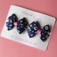 Navy hair bows with pink and white daisy pattern