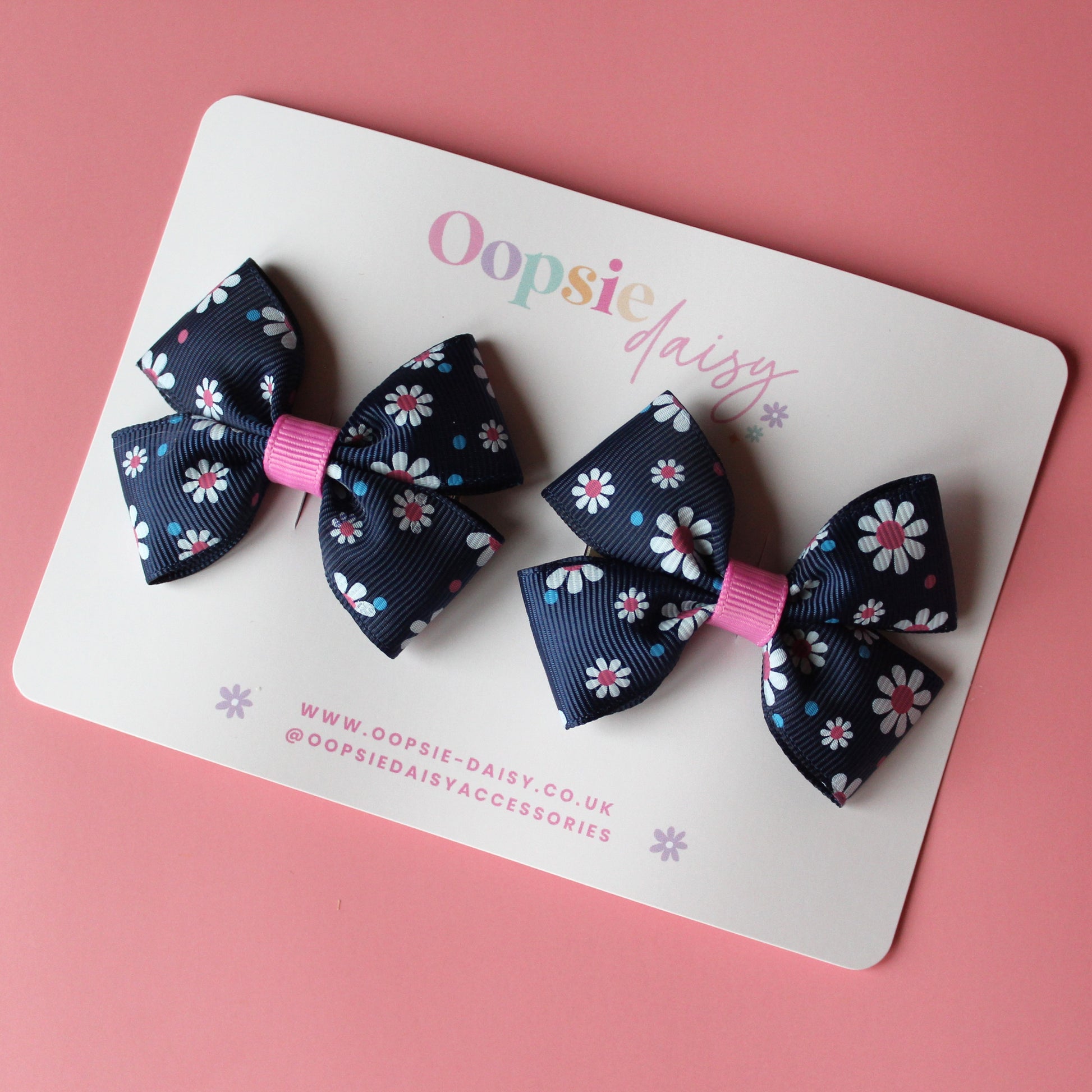 Navy hair bows with pink and white daisy pattern