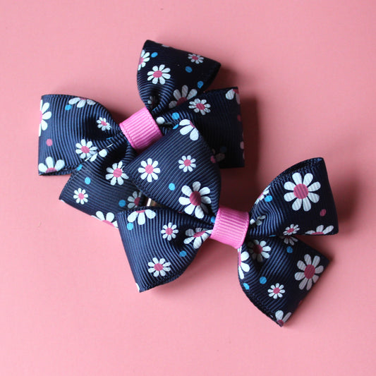 Navy hair bows with pink and white daisy pattern