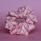 Pink oversized hair scrunchie with red and white check pattern