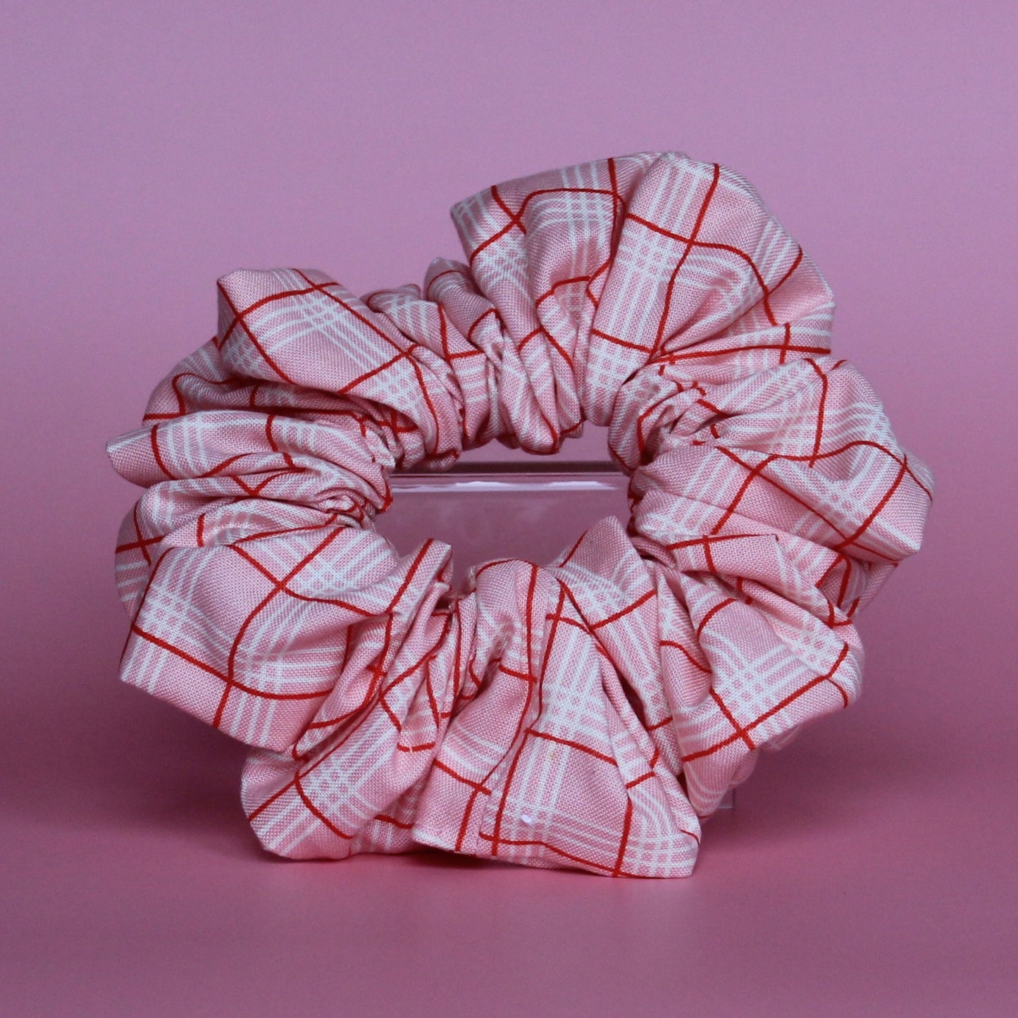 Pink oversized hair scrunchie with red and white check pattern